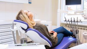 Woman relaxing in chair before IV sedation in Pittsburgh